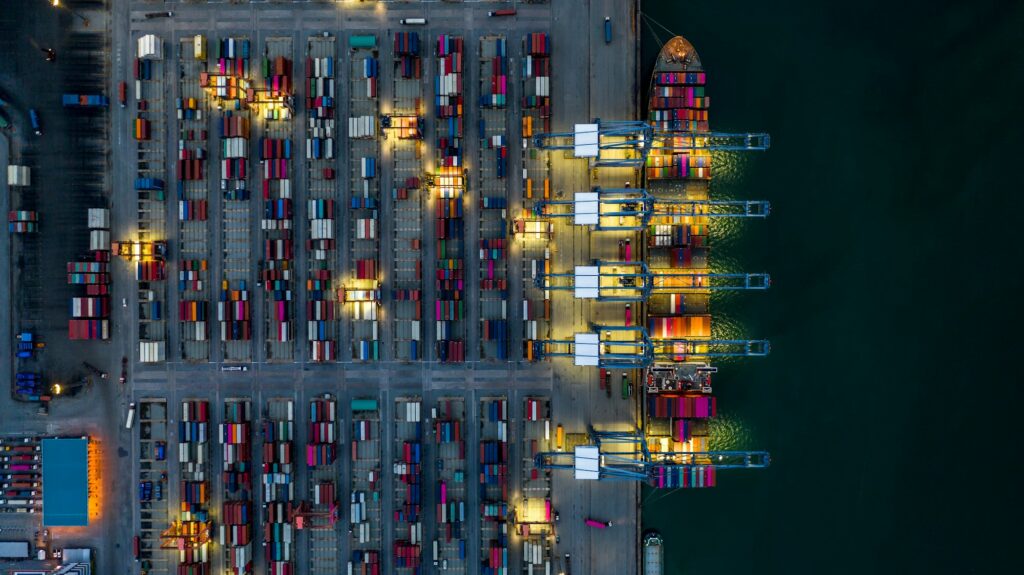 Aerial view container cargo ship industrial port working at night, Container cargo ship.