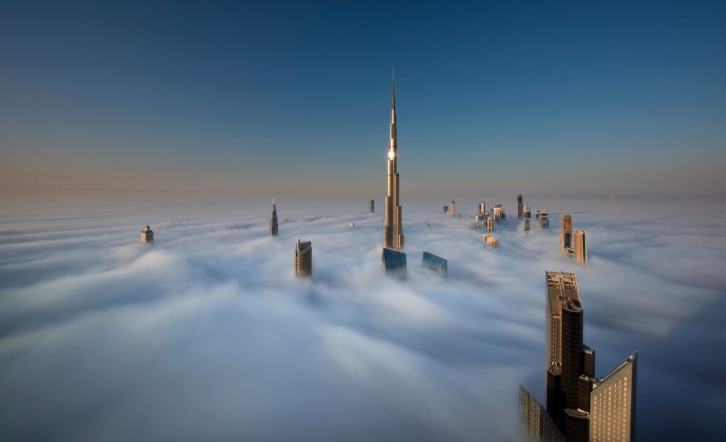 View of the Burj Khalifa and other skyscrapers above the clouds in Dubai, United Arab Emirates.